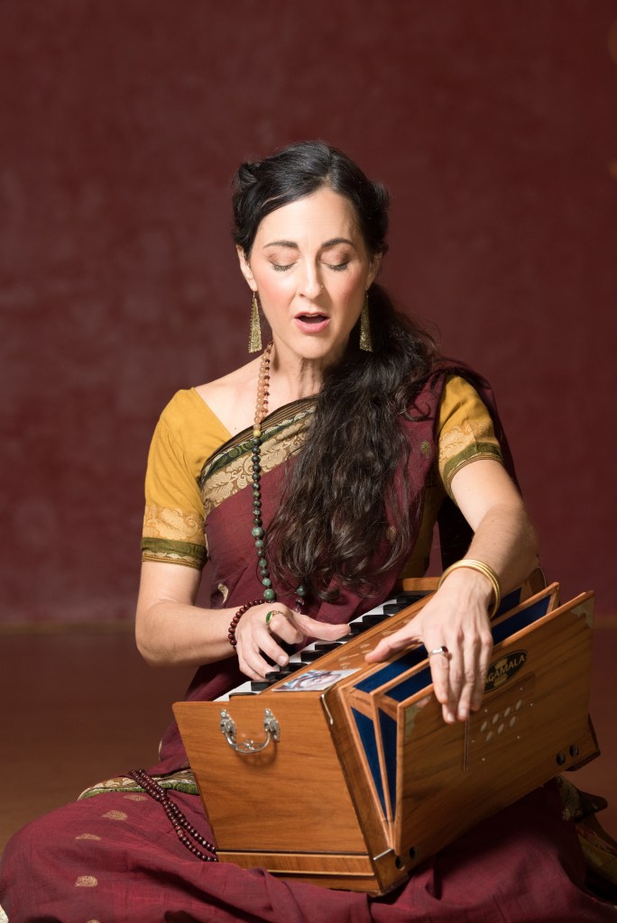 kavita macmillan playing harmonium.